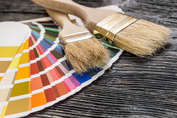 istock Paint brushes on the color swatches book 617375828