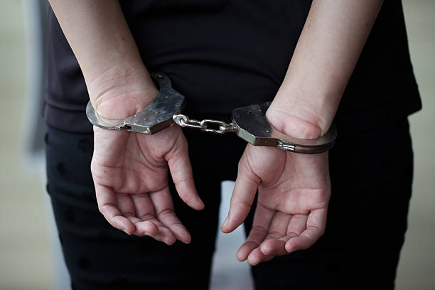 istock Criminal in handcuffs arrested for crimes. 617376266