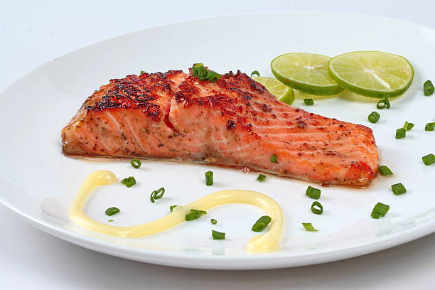 istock Close up grilled salmon served on white dish. 617376298