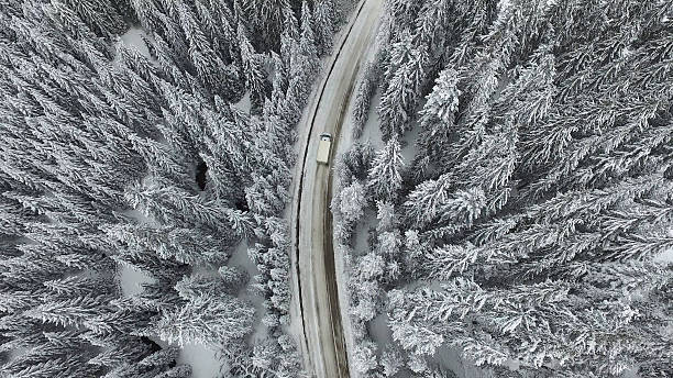 istock Snowy Winter Road with a Car 617377252
