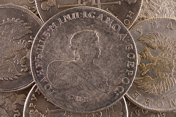 istock Vintage background silver ruble coin 1741 Russian emperor John Third 617378172