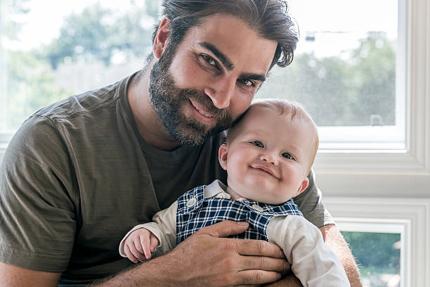 istock Modern Dad Posing with his Baby Boy 617379272