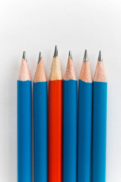 istock Simple pencils, one red among the blue 617379630