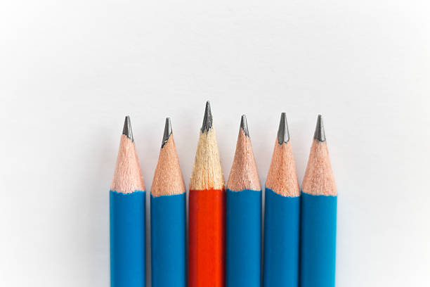 istock Simple sharp pencils isolated on white background, red among blue 617379694