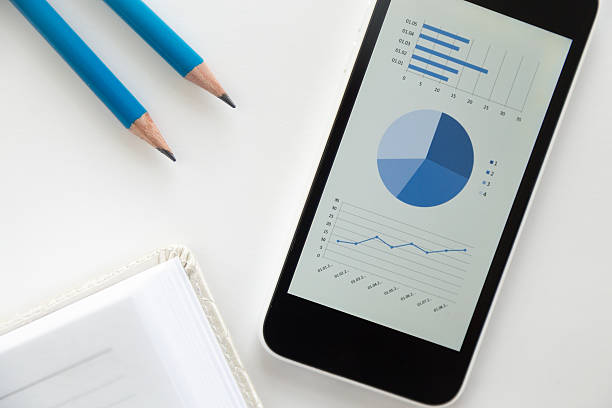 istock Top view of a mobile phone on a desk, diagram 617381174