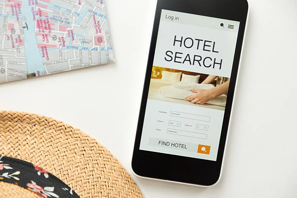 istock Top view of mobile phone, hotel search on the screen 617381244