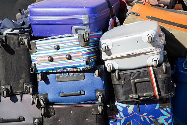 istock many colorful suitcases on a pile 617381326