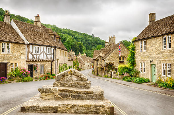 Castle Combe, Cotswold village Historic houses in the Cotswold village of Castle Combe, described as the prettiest village in England and a major tourist destination close to the city of Bath and Stonehenge. bath england stock pictures, royalty-free photos & images