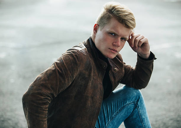 istock Young handsome stylish man in brown jacket in autumn time 617383368