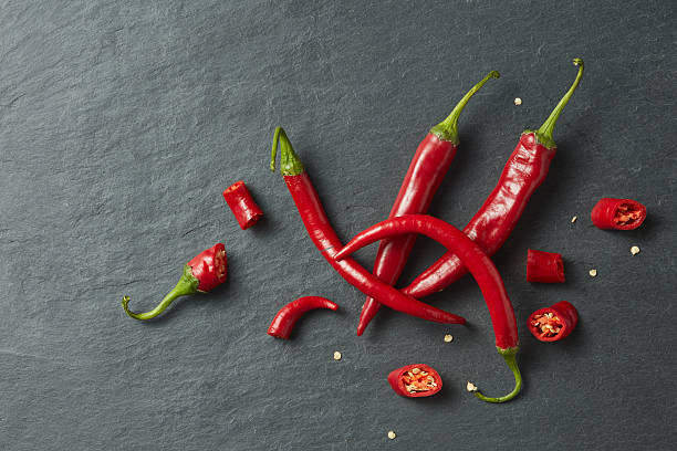 istock Sliced fresh red chillies isolated 617383386