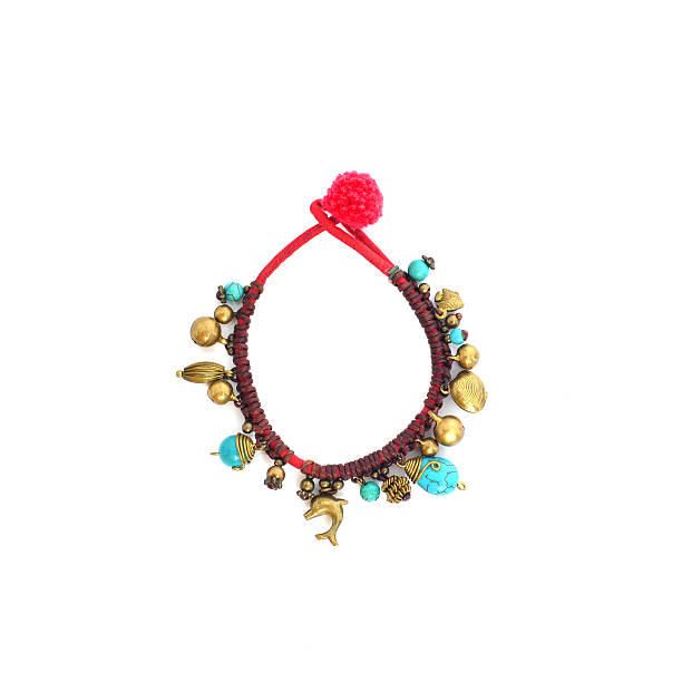 istock blue braided red bracelet on white background. brass 617383826