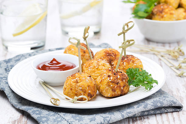 istock chicken meatballs in breading with tomato sauce 617384232