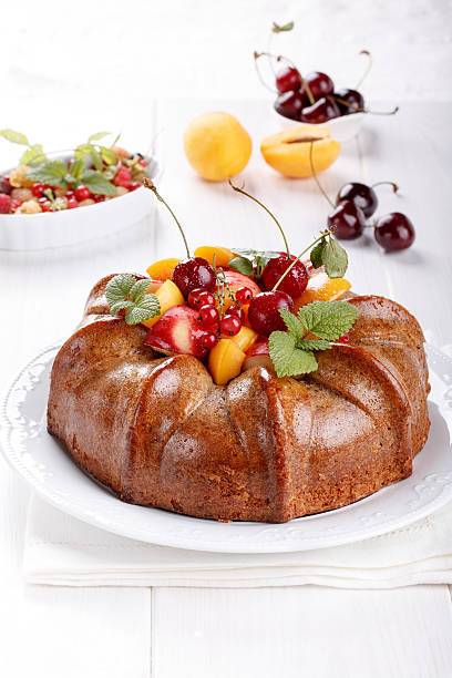 istock Naked cake derorated fresh fruit and berries 617384352