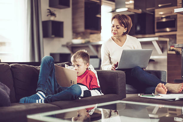 istock Little boy at home with his mother 617385376
