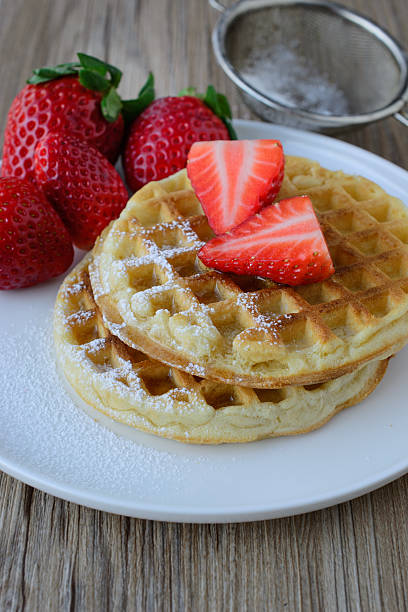 istock healthy breakfast waffle with strawberry  and maple syrup on top 617385834