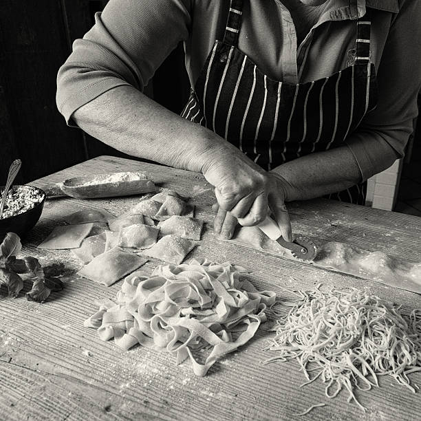 Making Homemade Pasta Woman making homemade pasta. ricotta photos stock pictures, royalty-free photos & images