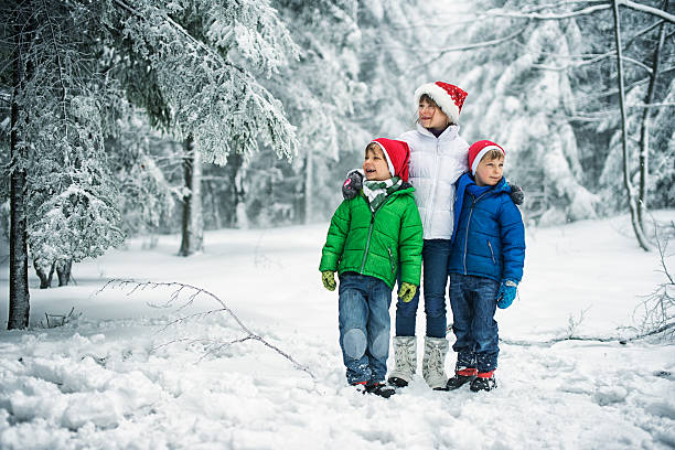 istock Kids enjoying snow and christmas 617386934