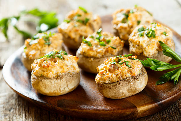 Stuffed mushrooms Stuffed mushrooms with salmon and cream edible mushroom stock pictures, royalty-free photos & images