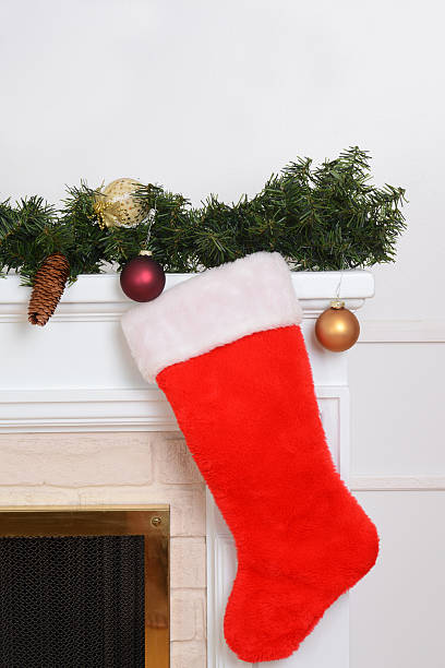 istock closeup santa sock on fireplace 617387346
