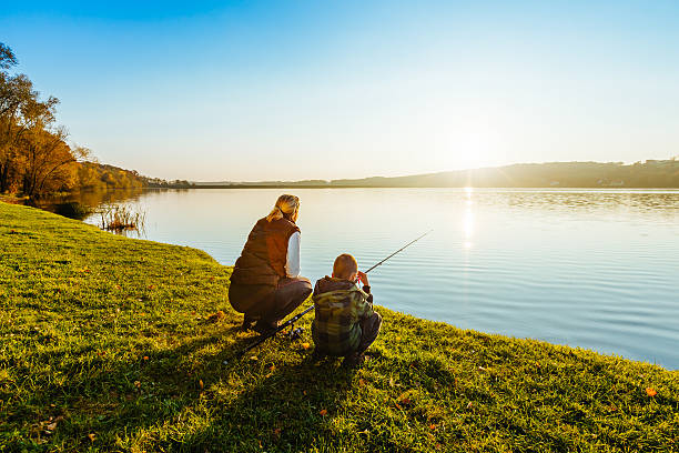 istock Mother and son fishing 617387434