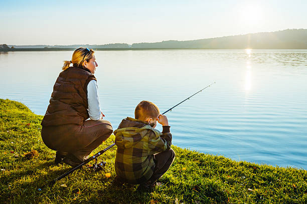 istock Mother and son fishing 617387566