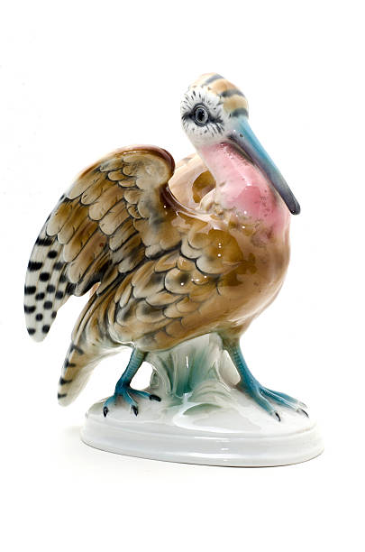 istock Porcelain bird figurine on white background. 617387786