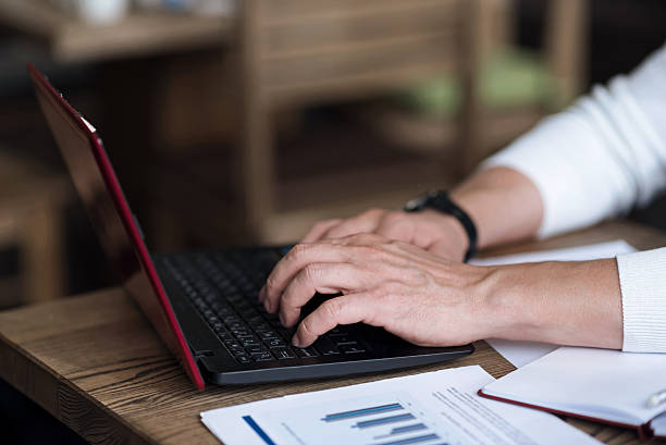 istock Close up of man typing on computer 617387798