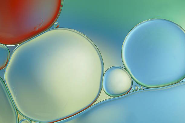 istock Oil drops on water surface - red and blue (474) 617388512