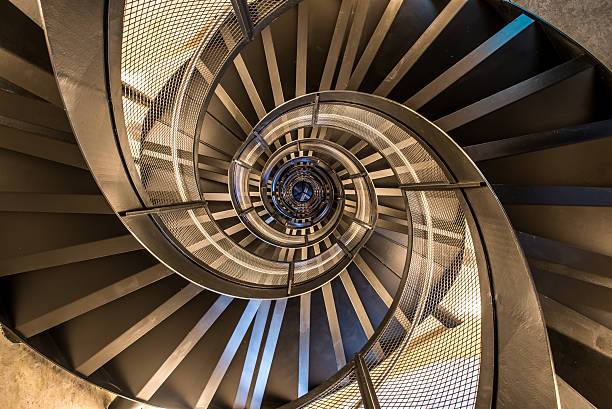 spiral staircase in tower - interior architecture of building - circle of stones imagens e fotografias de stock