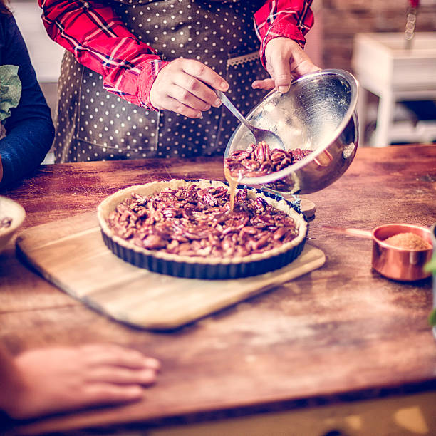 istock Preparing Homemade Pecan Pie for the Holidays 617388880