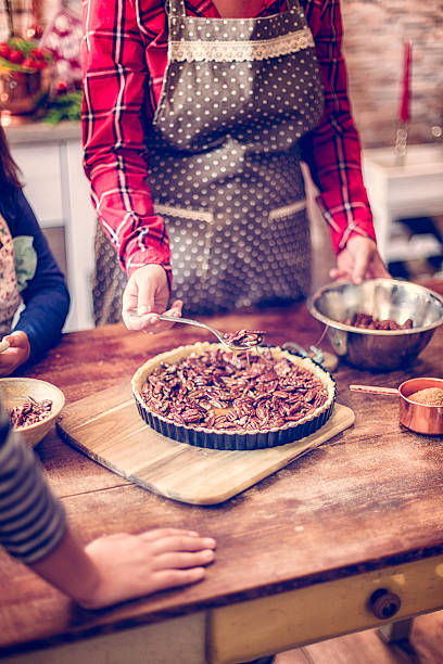 istock Preparing Homemade Pecan Pie for the Holidays 617389020