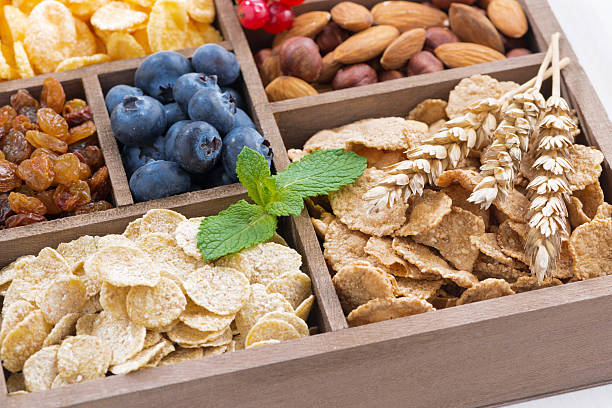 istock assortment of breakfast cereal, dried fruit, berries and nuts 617389570
