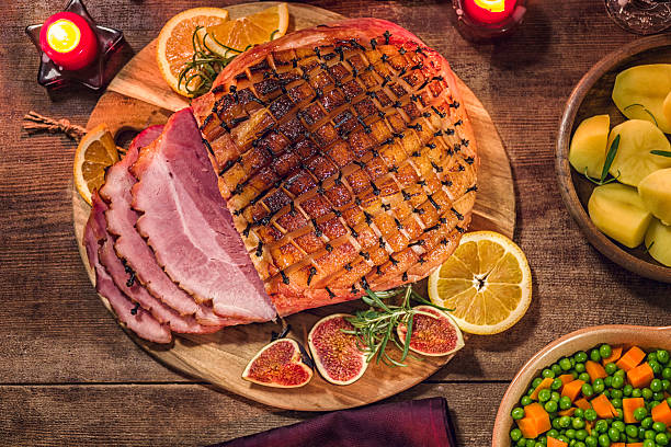 istock Glazed Holiday Ham with Cloves Background 617391248