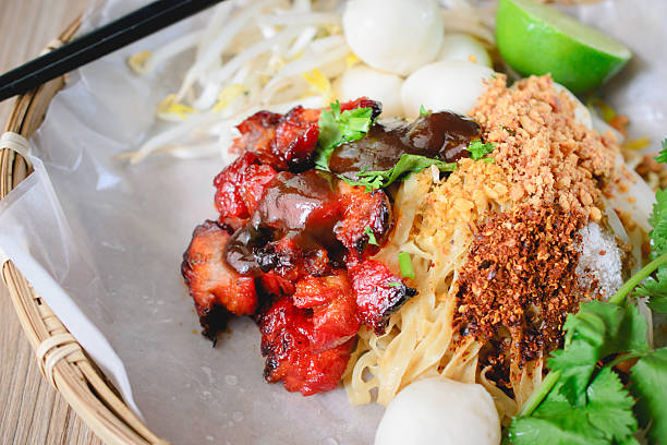 istock Egg Noodles and Red Pork  on wood background, 617391748