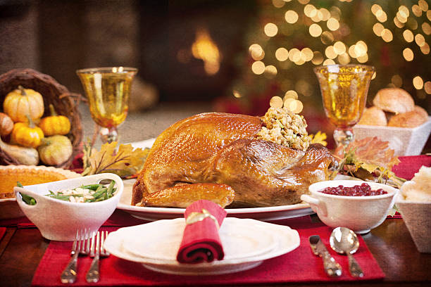 istock Thanksgiving Christmas Elegant Holiday Turkey Dinner and Christmas Tree 617392844