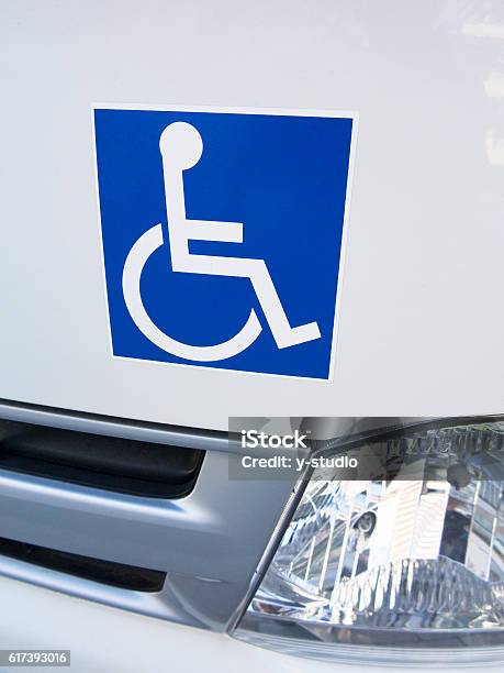 Disabled Sticker On A Car Stock Photo - Download Image Now - Bumper Sticker, Disability, Label