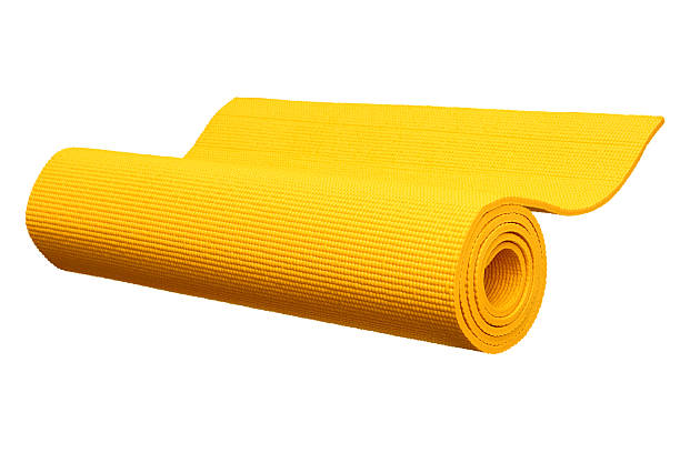 istock Yellow yoga mat isolated on white 617393360