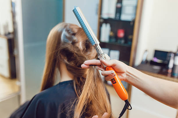 istock Hair stylist makes the bride before wedding 617395726