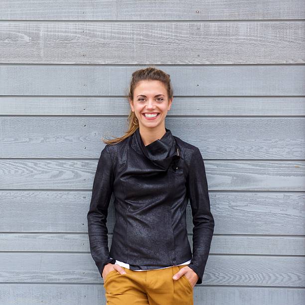 istock Smiling confident woman in leather jacket 617395736