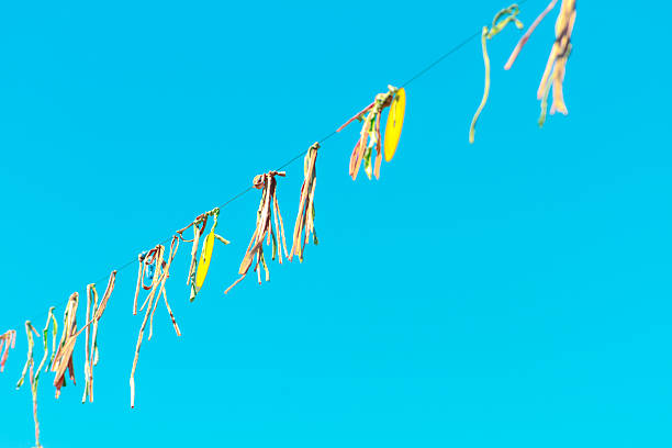 istock Garland made with strips of cloth hung with a CD 617396242