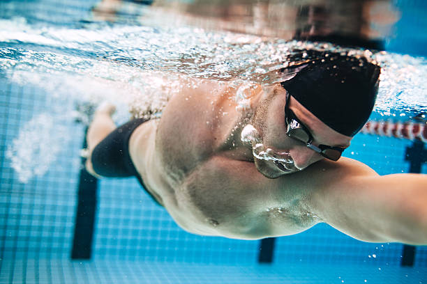 istock Male swimmer Under Water in Pool 617397794