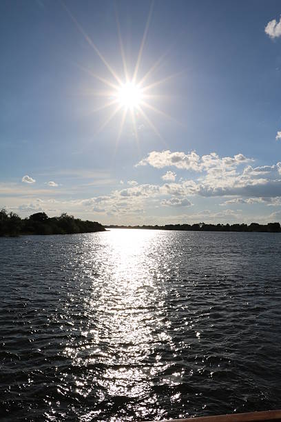 istock Sun is going under at the Sambesi River, Zambia Africa 617397852