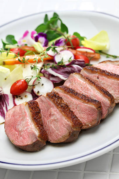 istock roast duck breast with vegetables 617398400