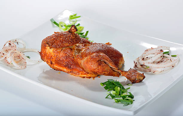 istock Chicken leg grilled on plate 617398906