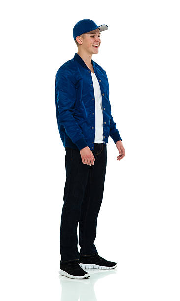 istock Smiling male standing and looking away 617562028
