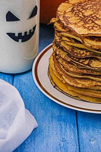 istock Pumpkin pancakes and boo milk bottle 617563574
