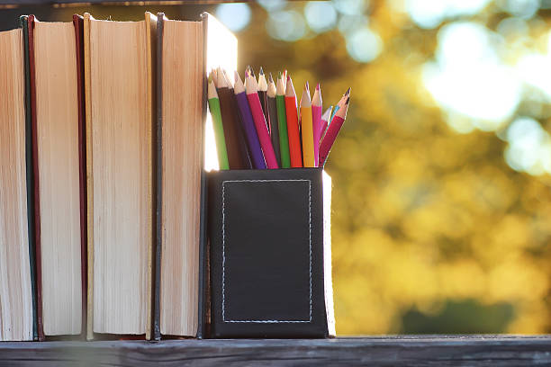 istock autumn book stack wooden outdoor 617563932