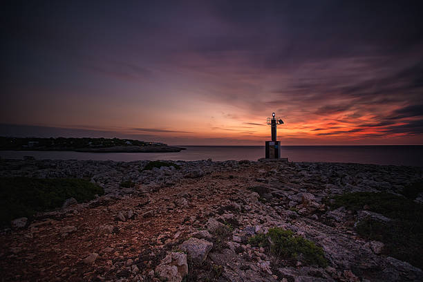 istock Light Beacon on a Beach in Mallorca, Spain at Sunrise 617564278