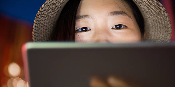 young women looking at digital tablet stock photo