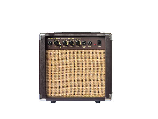 istock Small acoustic guitar amplifier isolated on white background 617565138